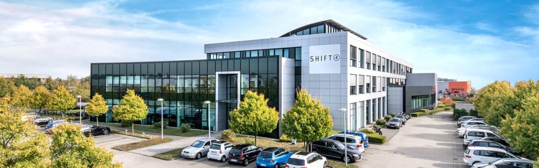 Firmensitz von Vectron by Shift4 mit SHIFT4-Logo an der Fassade