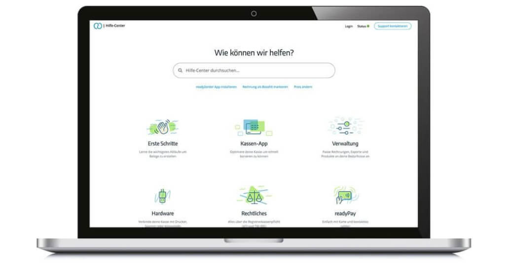 Ein schwarzes Laptop zeigt die "Hilfe-Center"-Website von ready2order mit verschiedenen Unterstützungsoptionen wie Hardware, Kassen-App und readyPay.